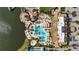 Aerial view of resort-style community amenities, including a pool, clubhouse, and lakefront access at 17905 Waterville Pl, Bradenton, FL 34202