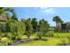 Lush backyard with green grass, landscaping and a fence, perfect for outdoor enjoyment at 17905 Waterville Pl, Bradenton, FL 34202