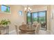 Cozy dining area with round table, chandelier, and view to patio at 17905 Waterville Pl, Bradenton, FL 34202