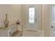 Welcoming entryway with patterned glass door and ornamental table at 17905 Waterville Pl, Bradenton, FL 34202
