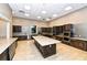Spacious kitchen featuring ample counter space, modern appliances, and a large center island at 17905 Waterville Pl, Bradenton, FL 34202