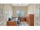 Functional home office with a large desk, chair, and filing cabinet at 17905 Waterville Pl, Bradenton, FL 34202