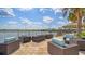 Inviting outdoor patio featuring comfortable lounge seating with lake view at 17905 Waterville Pl, Bradenton, FL 34202