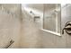 Modern tiled shower features glass enclosure, handheld and overhead shower heads at 17905 Waterville Pl, Bradenton, FL 34202
