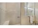 Tiled walk-in shower features a built-in bench and decorative tile accents at 17905 Waterville Pl, Bradenton, FL 34202