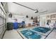 Well-lit garage with storage, showcasing space for vehicles, equipment, and projects, adding practicality to the home at 1831 San Silvestro Dr, Venice, FL 34285