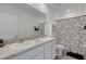 Bathroom with dual sinks, granite countertops, and a tub/shower with a floral curtain at 1860 Pleasant Maple Ct, Bradenton, FL 34211