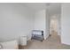 Bedroom featuring neutral carpet, a changing table, and a white wicker basket at 1860 Pleasant Maple Ct, Bradenton, FL 34211