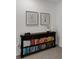 Dark wood bookshelf with books and decorative items at 1860 Pleasant Maple Ct, Bradenton, FL 34211