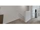 Hallway with carpet, neutral walls, and view of a bedroom with white trim at 1860 Pleasant Maple Ct, Bradenton, FL 34211