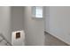 Hallway features neutral carpet, white trim, and stairwell at 1860 Pleasant Maple Ct, Bradenton, FL 34211