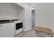 Laundry room with side-by-side washer and dryer and adjacent bench storage at 1860 Pleasant Maple Ct, Bradenton, FL 34211