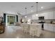 Inviting living room seamlessly connects to the kitchen, creating an open and airy space at 1860 Pleasant Maple Ct, Bradenton, FL 34211