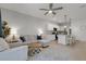 Open living space featuring a comfortable seating area and modern kitchen with island at 1860 Pleasant Maple Ct, Bradenton, FL 34211