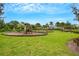 Well-maintained community playground with slides, swings, and picnic shelter at 1860 Pleasant Maple Ct, Bradenton, FL 34211