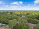 This aerial view showcases the property's location, surrounded by lush greenery at 1930 Peppermill Dr, Clearwater, FL 33763
