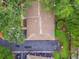 An aerial view shows the home's roof and adjacent guest parking at 1930 Peppermill Dr, Clearwater, FL 33763