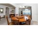Elegant dining area with a chandelier, large table, and seamless connection to other living spaces at 2160 Brandon Park Cir, Brandon, FL 33510