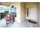 Cozy front porch featuring rocking chairs for relaxing outdoor seating and decorative pillows at 2160 Brandon Park Cir, Brandon, FL 33510