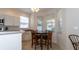 Eat-in kitchen with a table and chairs next to large windows, offering a cozy dining space at 2160 Brandon Park Cir, Brandon, FL 33510