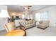 Bright living room with plentiful seating connects the kitchen and dining areas for flexible entertaining at 2160 Brandon Park Cir, Brandon, FL 33510