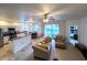 An open-concept living space connects the kitchen to the seating area, with sliding glass doors at 2160 Brandon Park Cir, Brandon, FL 33510