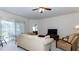 Comfortable living room with neutral tones, ceiling fan, and sliding glass doors to patio area at 2160 Brandon Park Cir, Brandon, FL 33510
