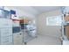 Storage room with adjustable metal shelving, window and carpeted floor at 2160 Brandon Park Cir, Brandon, FL 33510