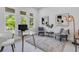 Bright office space with a glass desk, comfortable seating, and natural light at 2182 Wisteria St, Sarasota, FL 34239