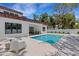 Backyard oasis with a sparkling pool and plenty of space for lounging and entertaining at 2182 Wisteria St, Sarasota, FL 34239