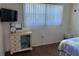 Bedroom with natural lighting featuring a TV and dresser with decorative ocean themed accents at 2218 Orange Blossom Ln # 0, Bradenton, FL 34207