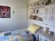 Comfortable bedroom features a cozy bed, built-in shelving, and bright, natural light at 2218 Orange Blossom Ln # 0, Bradenton, FL 34207