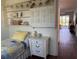 Cozy bedroom features a comfortable bed, built-in shelving, and bright, natural light at 2218 Orange Blossom Ln # 0, Bradenton, FL 34207