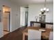 Open concept dining room with hardwood flooring and view into the kitchen at 2218 Orange Blossom Ln # 0, Bradenton, FL 34207