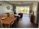 Living room with dining table and view of the outdoor lanai at 2218 Orange Blossom Ln # 0, Bradenton, FL 34207