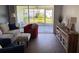 Living room with view of screen lanai and well kept lawn at 2218 Orange Blossom Ln # 0, Bradenton, FL 34207