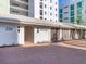 The exterior of the building features a private entrance, brick sidewalks and well maintained landscaping at 226 Golden Gate Pt # 63, Sarasota, FL 34236