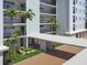 The condo building features lush tropical landscaping, a covered entryway and multiple private balconies at 226 Golden Gate Pt # 63, Sarasota, FL 34236