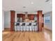 Stylish kitchen with cherry wood cabinets, stainless steel appliances, and bar seating with bay views at 226 Golden Gate Pt # 63, Sarasota, FL 34236