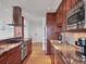Gourmet kitchen with stainless appliances, custom cabinets and granite countertops at 226 Golden Gate Pt # 63, Sarasota, FL 34236