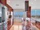 Well-appointed kitchen boasting cherry cabinets, stainless appliances, and a granite-topped island at 226 Golden Gate Pt # 63, Sarasota, FL 34236
