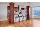 Modern kitchen with stainless steel appliances, granite countertops, and stunning views of the water at 226 Golden Gate Pt # 63, Sarasota, FL 34236