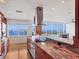 Open kitchen features custom cabinets, granite countertops, modern appliances, and gorgeous water views at 226 Golden Gate Pt # 63, Sarasota, FL 34236