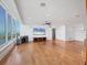 Bright living room features hardwood floors and breathtaking water views at 226 Golden Gate Pt # 63, Sarasota, FL 34236