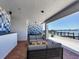 Inviting outdoor seating area on the patio with stylish furniture and a waterfront view to enjoy the picturesque scenery at 226 Golden Gate Pt # 63, Sarasota, FL 34236