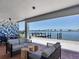 Inviting outdoor seating area with waterfront views, stylish furniture, and a relaxing atmosphere at 226 Golden Gate Pt # 63, Sarasota, FL 34236