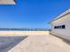 Expansive rooftop deck offers stunning water views of the bridge and surrounding scenery on a clear sunny day at 226 Golden Gate Pt # 63, Sarasota, FL 34236
