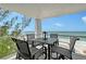 Relax on the balcony with stunning ocean views, complete with an outdoor dining set for entertaining at 2425 Gulf Of Mexico Dr # 6A, Longboat Key, FL 34228