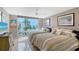 Bright bedroom with two twin beds, white tile floors, and a large window with a great view at 2425 Gulf Of Mexico Dr # 6A, Longboat Key, FL 34228