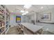 Bright conference room featuring a large table, comfortable seating, and ample shelving for resources at 2425 Gulf Of Mexico Dr # 6A, Longboat Key, FL 34228